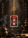 Rectangular Chinese talisman pendant with red and green details and a gold-colored cord