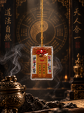 Rectangular Chinese talisman charm with a gold-colored cord and red knot