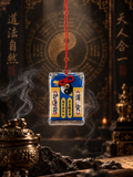 Blue Chinese talisman charm with yin-yang symbol and red hanging cord